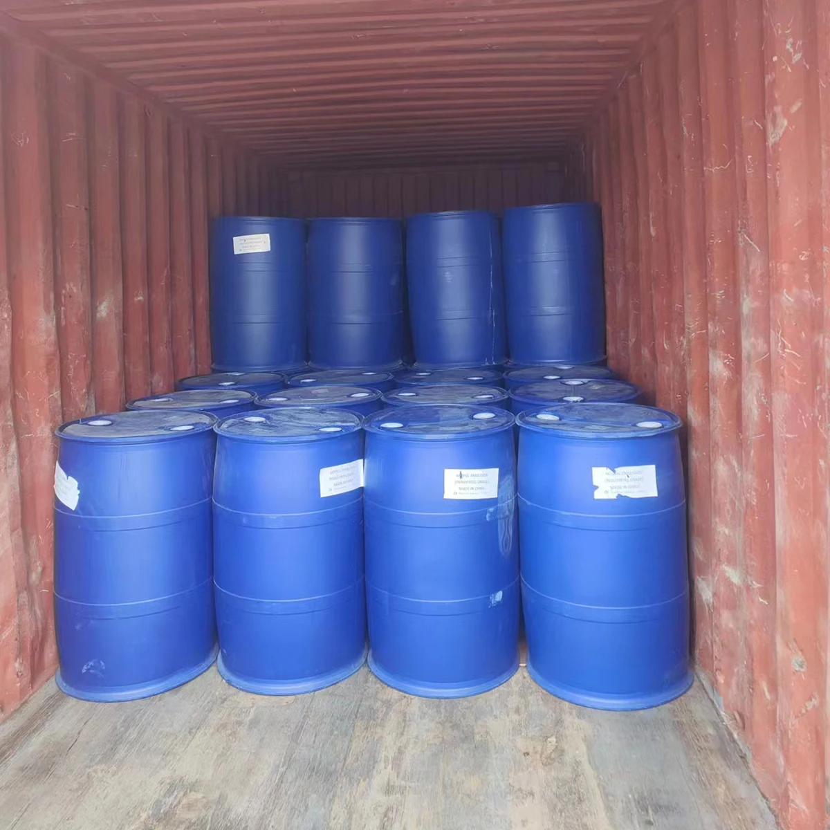 Blue product drums loaded inside a shipping container