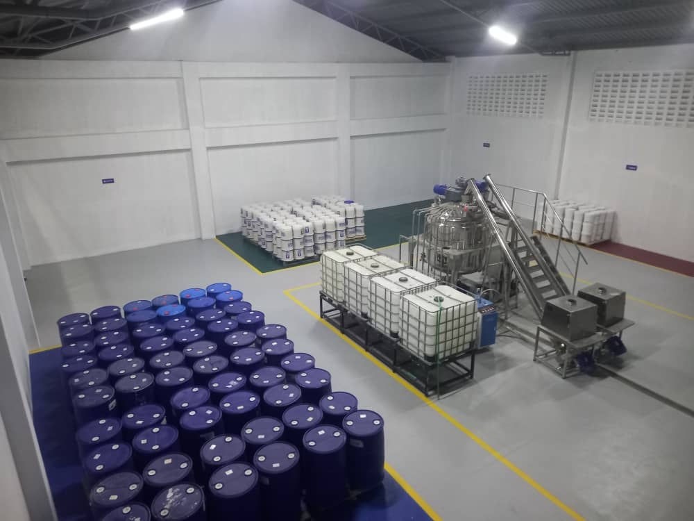 Another view of adhesive production equipment and material storage at the same customer project